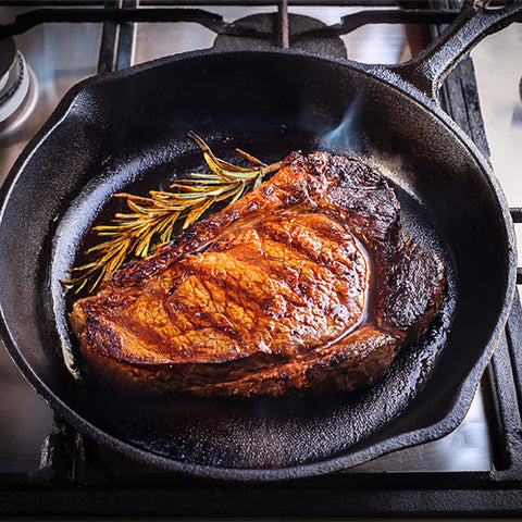 What is the reverse sear method for cooking steak?